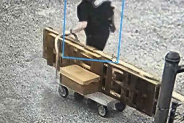 CORRECTS SOURCE This image provided by the Arkansas Department of Corrections shows Grant Hardin, a former police chief and convicted killer, escaping the North Central Unit prison wearing a disguise in Calico Rock, Ark. (Arkansas Department of Corrections via AP)