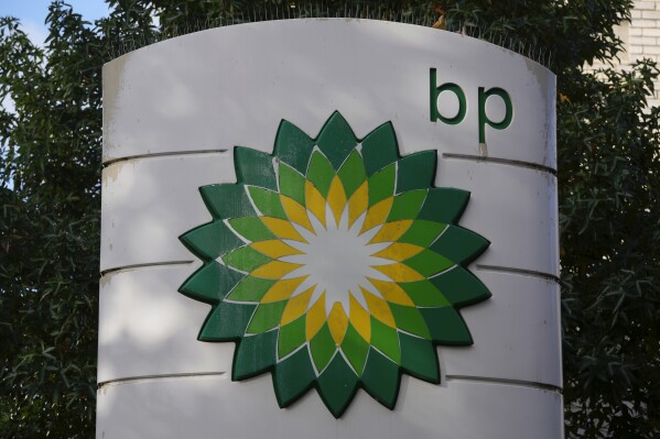 FILE - A logo of BP is seen at a gas station in London, on Nov. 1, 2022. Energy giant BP said Tuesday, Aug. 1, 2023 that it earned nearly $2.6 billion in the second quarter, almost half what it posted in the first three months of the year as oil and natural gas prices that surged after Russia's invasion of Ukraine have fallen. (AP Photo/Kin Cheung, File)
