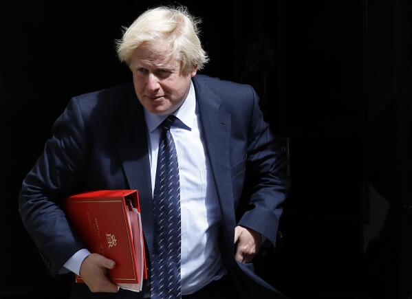 FILE - Britain's Foreign Secretary Boris Johnson leaves a cabinet meeting at 10 Downing Street after the general election in London, Tuesday, June 13, 2017. The British government is facing a Thursday deadline to hand over a sheaf of former Prime Minister Boris Johnson’s personal messages to the country’s COVID-19 pandemic inquiry. (AP Photo/Frank Augstein, File)