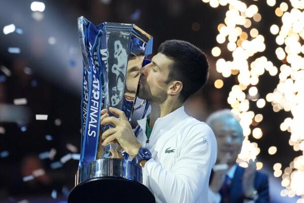 Serbia's Novak Djokovic poses with his trophy after defeating Norway's Casper Ruud 7-5, 6-3, in the singles final tennis match to win the ATP World Tour Finals at the Pala Alpitour, in Turin, Italy, Sunday, Nov. 20, 2022. (AP Photo/Antonio Calanni)