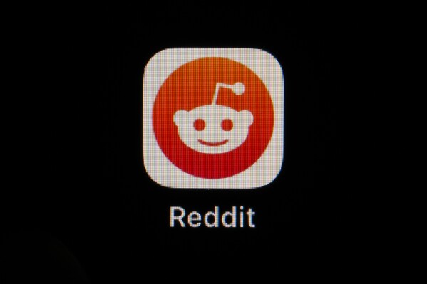FILE - The Reddit app icon is seen on a smartphone, Feb. 28, 2023, in Marple Township, Pa. Reddit is due to begin trading on the New York Stock Exchange on Tuesday, March 21, 2024. (AP Photo/Matt Slocum, File)
