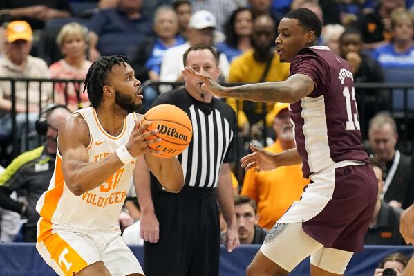 Tennessee guard Josiah-Jordan James (30) prepares to shoot as Mississippi State forward D.J. Jeffries (13) defends during the second half of an NCAA college basketball game in the Southeastern Conference men's tournament Friday, March 11, 2022, in Tampa, Fla. (AP Photo/Chris O'Meara)