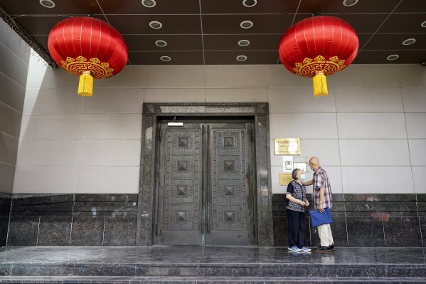 Visitors try to enter the Chinese Consulate General Wednesday, July 22, 2020, in Houston. China says the U.S. has ordered it to close its consulate in Houston in what it called a provocation that violates international law. (AP Photo/David J. Phillip)