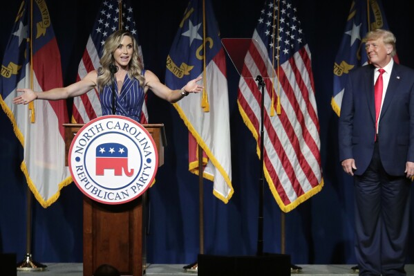 FILE - Former President Donald Trump, right, listens as his daughter-in-law Lara Trump speaks at the North Carolina Republican Convention, June 5, 2021, in Greenville, N.C. Donald Trump is calling for a shakeup at the highest levels of the Republican National Committee. And party leaders are taking it very seriously. (AP Photo/Chris Seward, Fike)