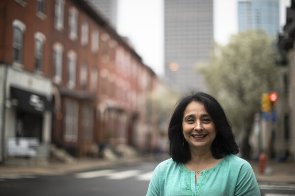 Suhag Shukla poses for a photograph in Philadelphia, Tuesday, March 31, 2020. Hindus around the world are in the midst of a 9-day celebration called Chaitra Navaratri that began with what for many is considered the Hindu New Year and will culminate with the festival of Ramanavami. Normally Shukla would be scrubbing her Philadelphia home more intensely than usual, a sign of the renewal the holiday signifies. There would be guests and Temple worship. But the temples are empty and the bells that worshippers ring are silent. (AP Photo/Matt Rourke)