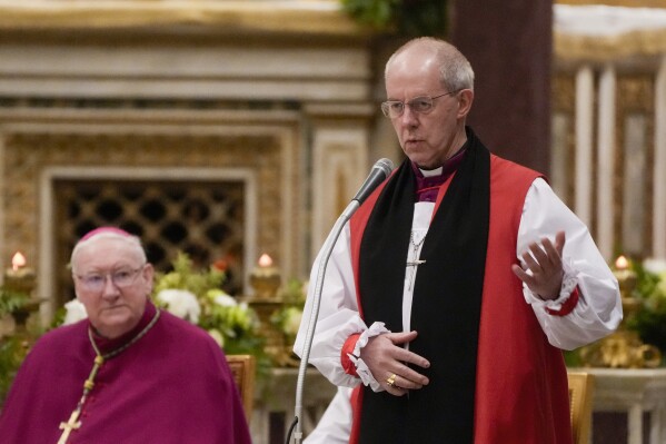 FILE - Archbishop of Canterbury Justin Welby delivers his speech as Pope Francis presides over the first vespers on the day the Catholic church celebrates the conversion of St. Paul, in the St.Paul's Basilica, in Rome, on Jan. 25, 2024. Welby, the leader of the Church of England said Monday Jan. 29, 2024 that Britain will undermine its standing in the world if it enacts a government plan to send some asylum-seekers on a one-way trip to Rwanda. (AP Photo/Gregorio Borgia, File)