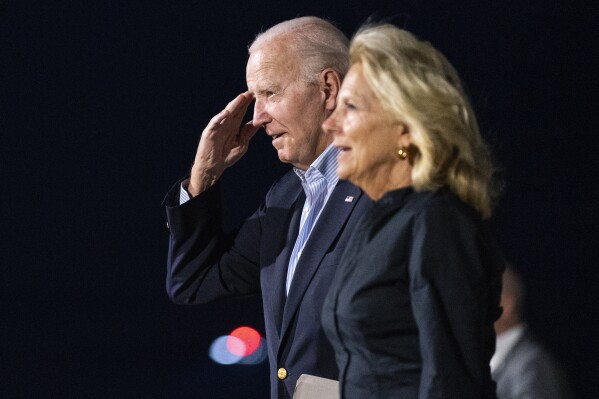 President Joe Biden and first lady Jill Biden arrive at Reno-Tahoe International Airport, Friday, Aug. 18, 2023, in Reno, Nev., for a vacation in the area. (AP Photo/Evan Vucci)