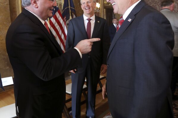 
              Elder Jack N. Gerard, a General Authority Seventy of The Church of Jesus Christ of Latter-day Saints, Utah Senate President Wayne Niederhauser and Gov. Gary Herbert talk after a press conference about a new medical cannabis policy in Utah at the Capitol in Salt Lake City on Thursday, Oct. 4, 2018. (Kristin Murphy/The Deseret News via AP)
            