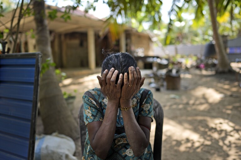 Rasalingam Thilakawathi cries for her missing daughter at her home in Mullaitivu, Sri Lanka, Tuesday, May 7, 2024. (AP Photo/Eranga Jayawardena)