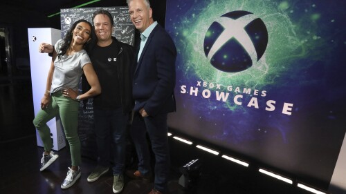 IMAGE DISTRIBUTED FOR XBOX - Sarah Bond, from left, CVP Game Creator Ecosystem, Phil Spencer, Head of Xbox, and Matt Booty, CVP Xbox Game Studios, pose during the 2023 Xbox FanFest on Sunday, June 11, 2023 in Los Angeles. (Casey Rodgers/AP Images for Xbox)