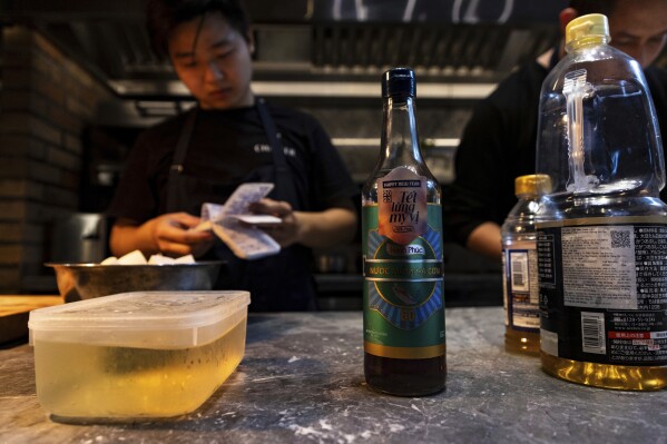 Dishes made with fish sauce are prepared at Chapter Dining, a fine dining restaurant, on March 1, 2025, in Hanoi, Vietnam. (AP Photo/Yannick Peterhans)