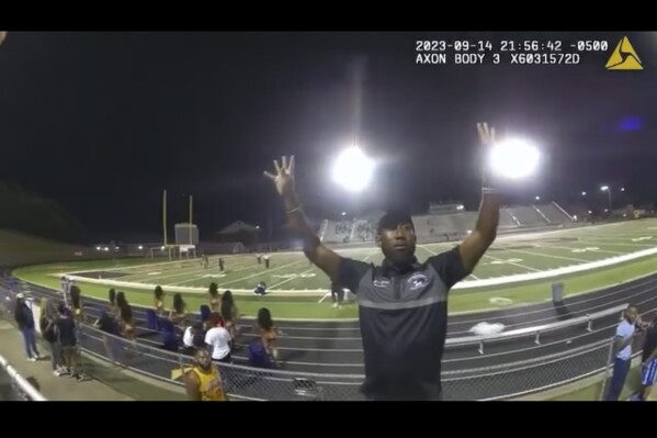 In an image made from video released by the Birmingham Police Dept., a high school band director is seen before he being tasered and arrested after refusing to stop his band from playing after a football game, Thursday, Sept. 14, 2023, in Birmingham, Ala. (Birmingham Police Dept. via AP)