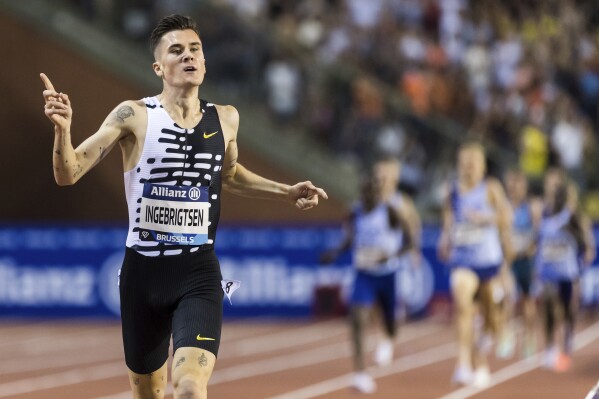 FILE - Jakob Ingebrigtsen from Norway crosses the finish line to win the 2000m men event and set a new world record time during the Diamond League Memorial Van Damme athletics event at the King Baudouin stadium, Brussels, on Sept. 8, 2023. Norwegian police launched an investigation Thursday, Oct. 26, 2023, into allegations by the three Ingebrigtsen brothers that their father, who had been their track coach at the Olympics and other events, was violent and abusive when they were growing up. (AP Photo/Geert Vanden Wijngaert)