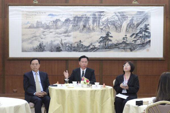 
              Taiwan's Foreign Minister Joseph Wu speaks to media during a press conference held in Taipei, Taiwan on Thursday, March 14, 2019. Wu says Washington should be concerned for strategic reasons that Taiwan is losing its diplomatic allies in Latin America to rival China. Seated with him are Henry Chen, Director-general MOFA's Department of International Information Service, left, and Adela Lin, Taipei Foreign Correspondents Club Chairwoman. (AP Photo/Johnson Lai)
            