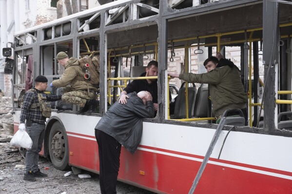 FILE- A man cries at the trolleybus after a Russian missile strike on Sumy, Ukraine, April 13, 2025. (AP Photo/Volodymyr Hordiienko, file)