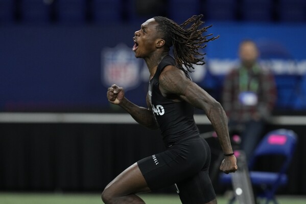 Texas wide receiver Xavier Worthy celebrates after running the 40-yard dash at the NFL football scouting combine, Saturday, March 2, 2024, in Indianapolis. (APPhoto/Darron Cummings)