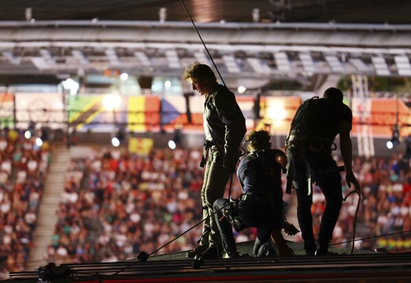 Actor Tom Cruise is photographed on the roof of the Stade de France  during the closing ceremony of the 2024 Summer Olympics, at the Stade de France, Sunday, Aug. 11, 2024, in Saint-Denis, France. (Fabrizio Bensch/Pool Photo via AP)