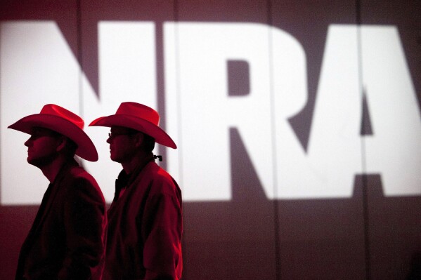 FILE - National Rifle Association members listen to speakers during the NRA's Annual Meetings and Exhibits at the George R. Brown Convention Center, May 4, 2013, in Houston. An NRA lawyer acknowledged in court Tuesday, Jan. 9, 2024, that some former executives and outside vendors may have ripped off the influential gun rights group with lavish spending and self-dealing. (Johnny Hanson/Houston Chronicle via AP, File)