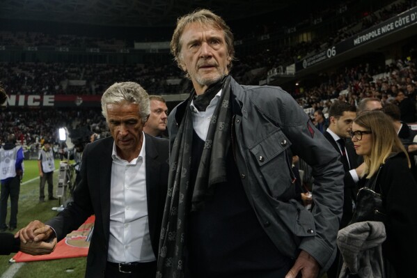 FILE - Sir Jim Ratcliffe looks on ahead of the French League One soccer match between Nice and Paris Saint Germain in Allianz Riviera stadium in Nice, southern France, on Oct.18, 2019. More than a year after it was put up for sale, Manchester United said Sunday that British billionaire Jim Ratcliffe had agreed to buy a minority stake in the storied Premier League club. Ratcliffe, who owns petrochemicals giant INEOS and is one of Britain’s richest people, has bought a stake of “up to 25%” of the 20-time league champions and will invest $300 million in its Old Trafford stadium. (AP Photo/Daniel Cole, File)