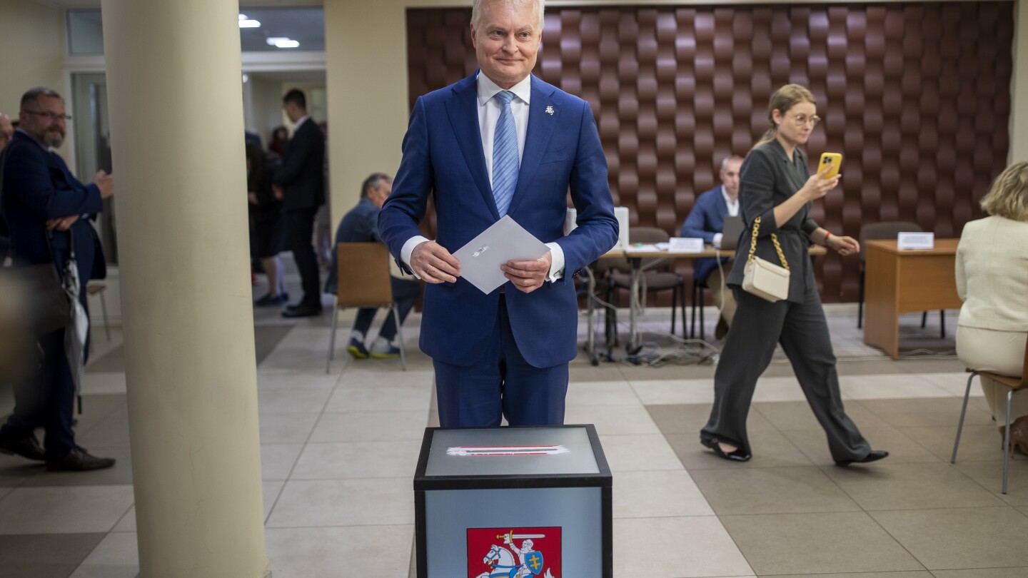 Lithuanians return to the polls with incumbent president favored to win 2nd election round