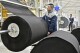 FILE - Workers produce car mats in a factory of car interior pieces in Yantai in east China's Shandong province on Feb. 21, 2024. China's manufacturing and investment improved in the first two months of the year, while weakness in the property sector weighed on the economy, the National Bureau of Statistics said Monday, March 18. (Chinatopix via AP, File)