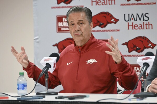 John Calipari answers questions from reporters after being introduced as Arkansas men's basketball coach Wednesday, April 10, 2024, in Fayetteville, Ark. (AP Photo/Michael Woods)