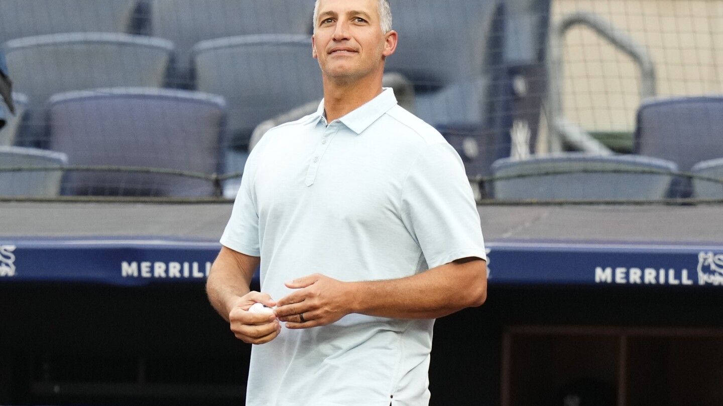 Houston Astros starting pitcher Andy Pettitte is escorted off the