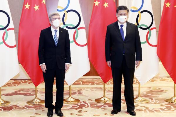 FILE - In this photo released by China's Xinhua News Agency, International Olympic Committee (IOC) President Thomas Bach, left, and Chinese President Xi Jinping meet at the Diaoyutai State Guesthouse in Beijing, Tuesday, Jan. 25, 2022. The last time the Olympics came to China, Xi Jinping oversaw the whole endeavor. Now the Games are back, and he is running the entire nation. The Chinese president, hosting a Winter Olympics beleaguered by complaints about human rights abuses, has upended tradition to restore strongman rule in China and tighten Communist Party control over the economy and society. (Yao Dawei/Xinhua via AP, File)