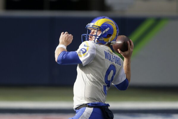 Los Angeles Rams quarterback John Wolford warms-up before an NFL wild-card playoff football game against the Seattle Seahawks, Saturday, Jan. 9, 2021, in Seattle. (AP Photo/Scott Eklund)
