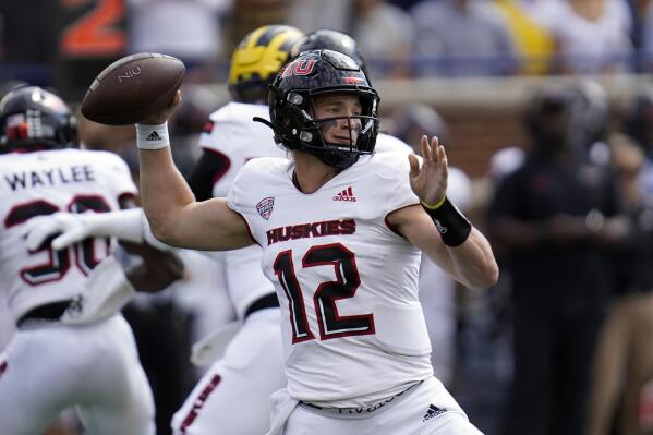 FILE - Northern Illinois quarterback Rocky Lombardi (12) throws against Michigan in the first half of a NCAA college football game in Ann Arbor, Mich., Sept. 18, 2021. Lombardi was looking for a new place to football after deciding to transfer from Michigan State nearly a year ago. Northern Illinois was searching for a quarterback to spark a turnaround. Lombardi and the Huskies proved to be a great match in the Mid-American Conference. (AP Photo/Paul Sancya, File)