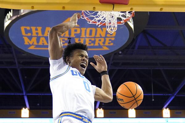 UCLA guard Jaylen Clark dunks during the first half of an NCAA college basketball game against Denver Saturday, Dec. 10, 2022, in Los Angeles. (AP Photo/Mark J. Terrill)