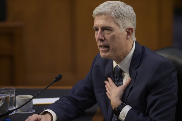
              FILE - In this March 22, 2017 file photo, then-Supreme Court Justice nominee Neil Gorsuch testifies on Capitol Hill in Washington. It took less than 15 minutes for newly-minted Justice Neil Gorsuch to ask his first questions from the bench. Gorsuch and his colleagues were hearing arguments Monday for the first time since President Donald Trump's pick was sworn in April 10.  (AP Photo/Susan Walsh, File)
            
