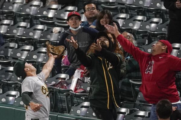 A's fan makes back-to-back foul ball catches 