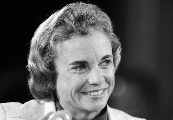 FILE - Supreme Court nominee Sandra Day O'Connor smiles during her appearance, Sept. 11, 1981, before the Senate Judiciary Committee on Capitol Hill. O'Connor who joined the Supreme Court in 1981 as the nation's first female justice, has died at age 93.(AP Photo/J.Scott Applewhite, File )