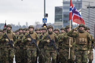 FILE - Norwegian soldiers march during a military parade ceremony marking the 105th anniversary of the Lithuanian military on Armed Forces Day in Vilnius, Lithuania, Saturday, Nov. 25, 2023. Norway is to increase the number of conscripted soldiers from the present 9,000 to 13,500, the Norwegian government said Tuesday, April 2, 2024. (AP Photo/Mindaugas Kulbis, File)