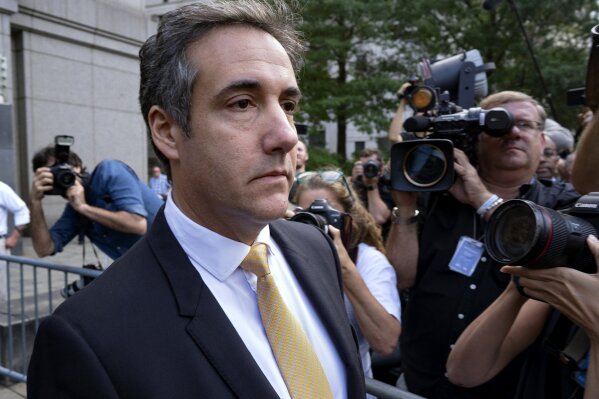 
              Michael Cohen, former personal lawyer to President Donald Trump, leaves federal court after reaching a plea agreement in New York, Tuesday, Aug. 21, 2018. Cohen, has pleaded guilty to charges including campaign finance fraud stemming from hush money payments to porn actress Stormy Daniels and ex-Playboy model Karen McDougal. (AP Photo/Craig Ruttle)
            