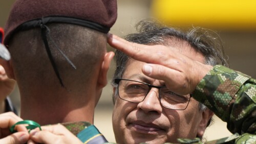 Colombia's President Gustavo Petro decorates a soldier that participated in the search of four Indigenous children who survived an Amazon plane crash, during a ceremony at the Palace of Narino in Bogota, Colombia, Monday, June 26, 2023. (AP Photo/Fernando Vergara)