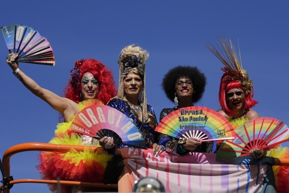 Revelers take part in the annual Gay Pride Parade in Sao Paulo, Sunday, June 2, 2024. (AP Photo/Andre Penner)