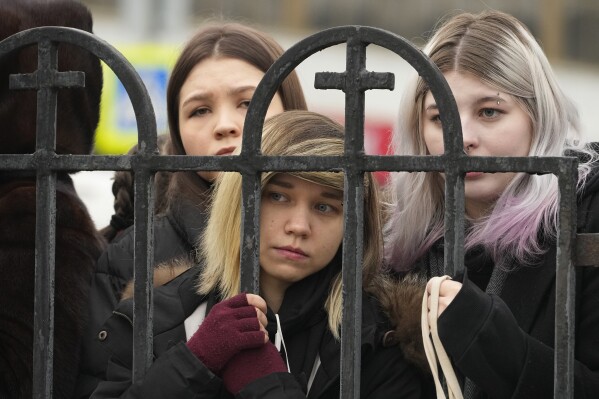 People gather outside the Church of the Icon of the Mother of God Soothe My Sorrows, in Moscow, Russia, Friday, March 1, 2024. Relatives and supporters of Alexei Navalny are bidding farewell to the opposition leader at a funeral in southeastern Moscow, following a battle with authorities over the release of his body after his still-unexplained death in an Arctic penal colony. (AP Photo)