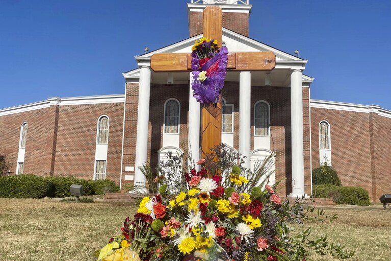 Flowers sit in a memorial to Bubba Copeland outside First Baptist Church in Phenix City, Ala., on Nov. 5, 2023. Copeland, the pastor of the church and the mayor of Smiths Station died by suicide. (AP Photo/Kim Chandler)