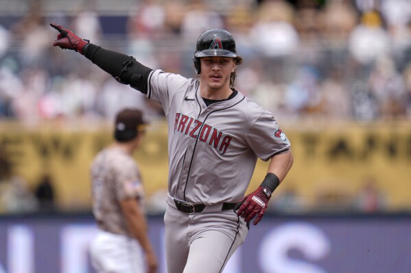Arizona Diamondbacks' Jake McCarthy celebrates after hitting a two-run home run during the second inning of a baseball game against the San Diego Padres, Sunday, June 9, 2024, in San Diego. (AP Photo/Gregory Bull)