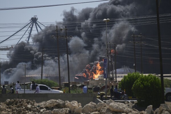 Smoke billows after drone strikes by the paramilitary Rapid Support Forces (RSF) targeted the northern port in the Red Sea city of Port Sudan, Sudan, Tuesday, May 6, 2025. (AP Photo)