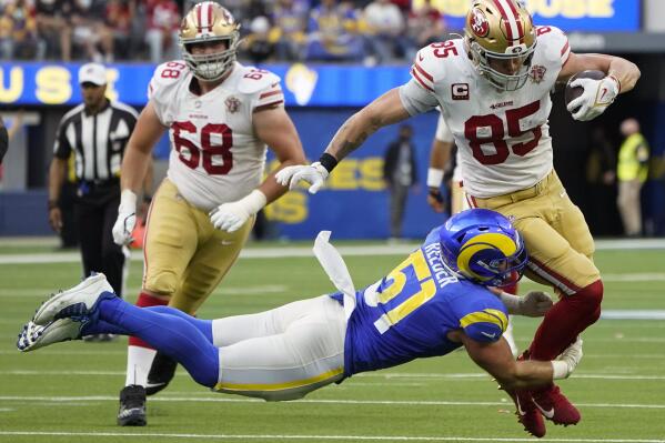 Los Angeles Rams inside linebacker Troy Reeder (51) tackles San Francisco 49ers tight end George Kittle (85) during the second half of an NFL football game Sunday, Jan. 9, 2022, in Inglewood, Calif. (AP Photo/Marcio Jose Sanchez)