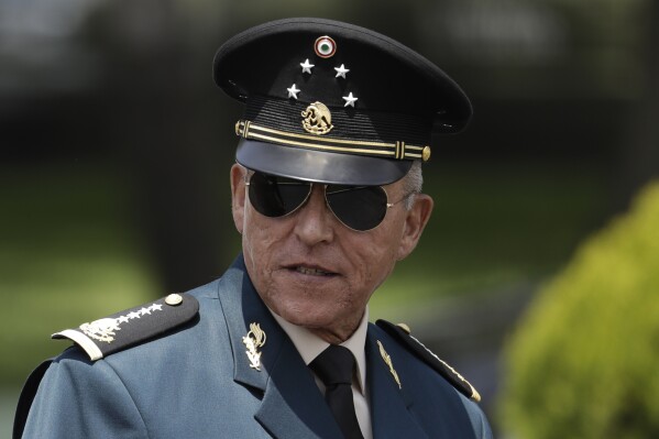 FILE - Secretary of Defense Salvador Cienfuegos Zepeda arrives for a review of the troops that will participate in the Independence Day parade, in Mexico City, Sept. 14, 2016. Cienfuegos, a former Mexican defense secretary whose arrest in the United States in 2020 on drug charges strained relations between the two countries was celebrated Wednesday, Oct. 11, 2023, with an honorary military decoration. (AP Photo/Rebecca Blackwell, File)