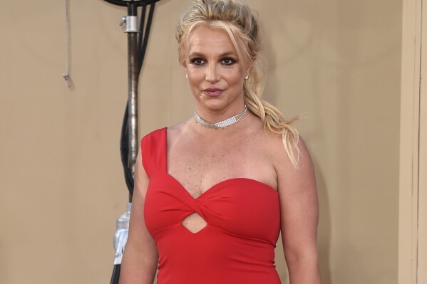 FILE - Britney Spears arrives at the Los Angeles premiere of "Once Upon a Time in Hollywood," on July 22, 2019. Spear’s highly anticipated memoir “The Woman in Me” will be released Tuesday, Oct. 24, 2023. (Photo by Jordan Strauss/Invision/AP, File)