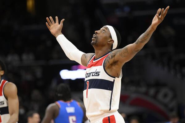 Washington Wizards guard Kentavious Caldwell-Pope (1) reacts after he made a 3-point basket during the second half of an NBA basketball game against the Oklahoma City Thunder, Tuesday, Jan. 11, 2022, in Washington. The Wizards won 122-118. (AP Photo/Nick Wass)