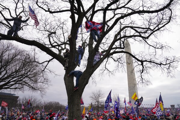 FILE - In this Wednesday, Jan. 6, 2021 file photo, supporters of President Donald Trump participate in a rally in Washington. (AP Photo/John Minchillo)