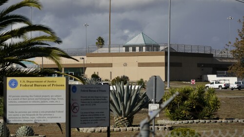 FILE - The Federal Correctional Institution stands in Dublin, Calif., Dec. 5, 2022. Two former officers the women’s prison pleaded guilty Thursday, July 13, 2023, to multiple counts of sexual abuse, the latest to be prosecuted following an AP investigation last year that resulted in prison sentences for the former warden and chaplain. (AP Photo/Jeff Chiu, File)