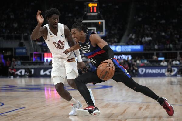 Detroit Pistons guard Jaden Ivey (23) drives on Cleveland Cavaliers guard Caris LeVert (3) in the second half of an NBA basketball game in Detroit, Friday, Nov. 4, 2022. (AP Photo/Paul Sancya)