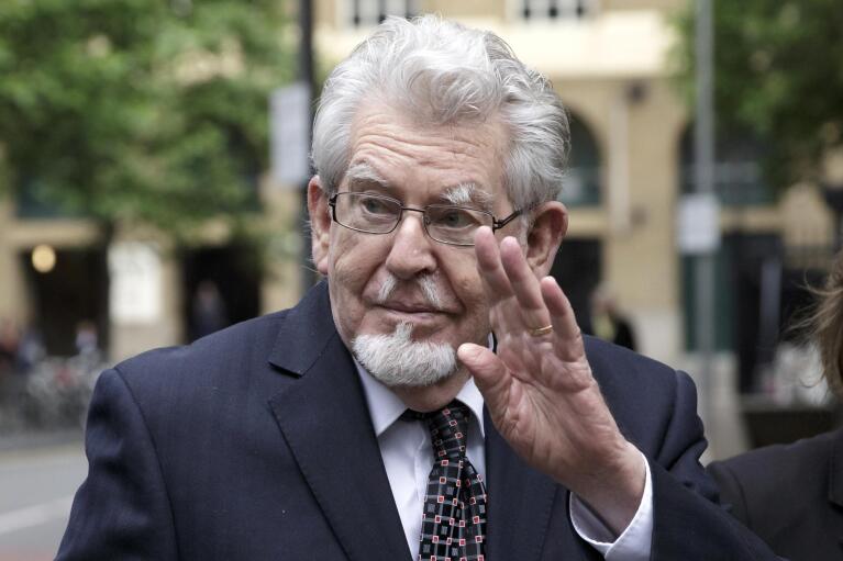 FILE - Convicted Sex offender Rolf Harris arrives at Southwark Crown Court where he is on trial for several counts of alleged indecent assault, in London, Monday May 22, 2017. Rolf Harris, the veteran entertainer whose decades-long career as a family favorite on British and Australian television was shattered when he was convicted of sexual assaults on young girls, has died. He was 93. (AP Photo/Tim Ireland, File)